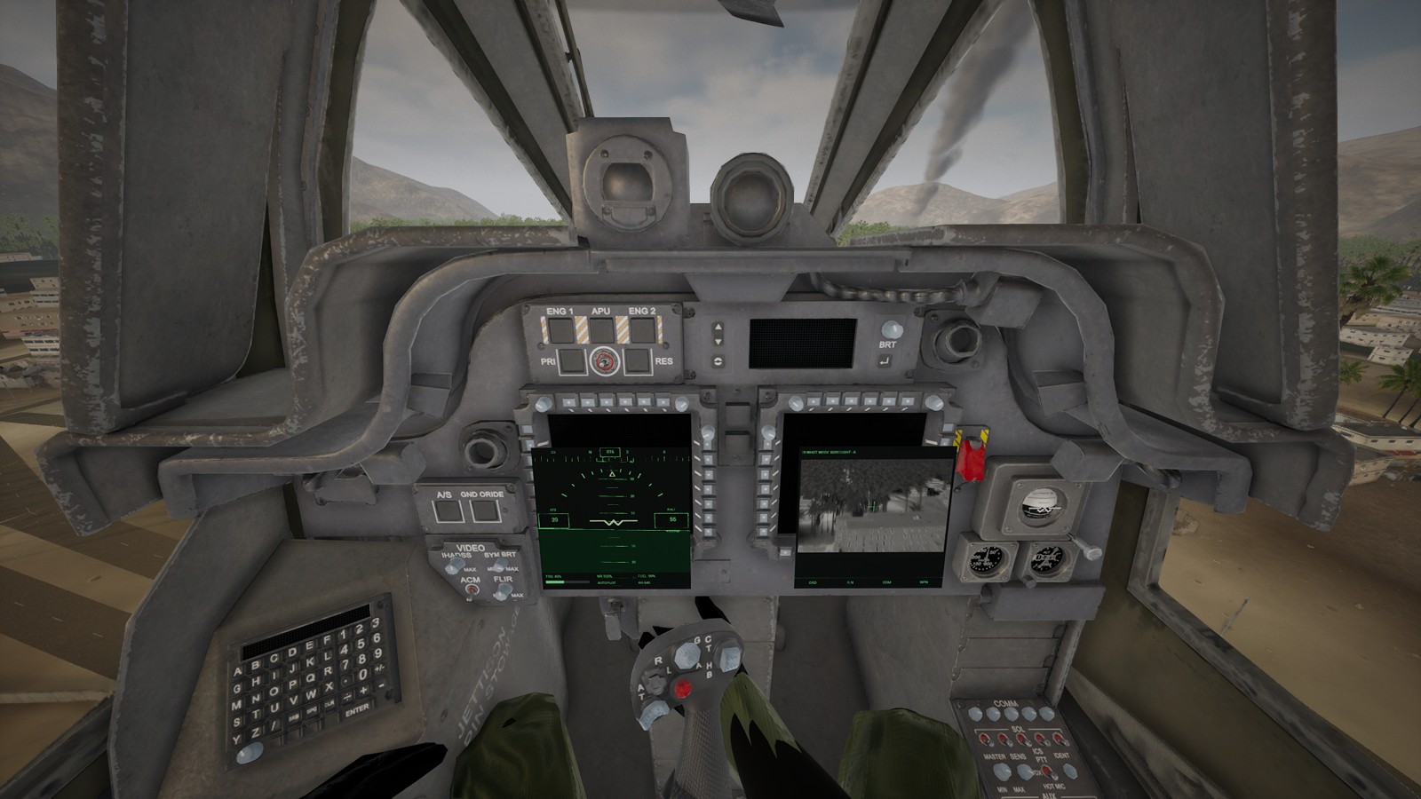 The Apache pilot's seat: his gloved hand on the stick, the flight display on the left screen and the thermal sight's live picture of the town on the right, smoke rising beyond the canopy.